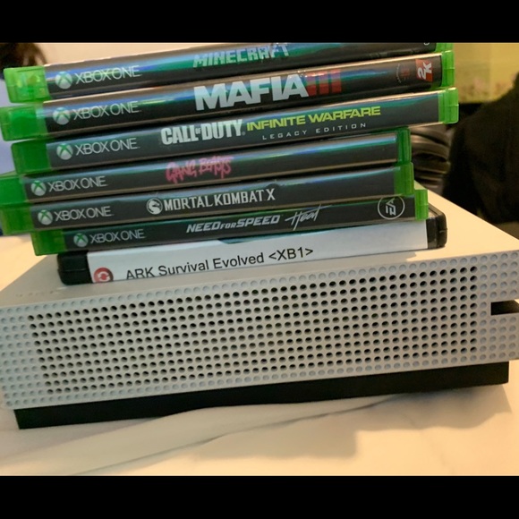 Console is in perfect condition comes with wires, video games and a controller. - Picture 7 of 7